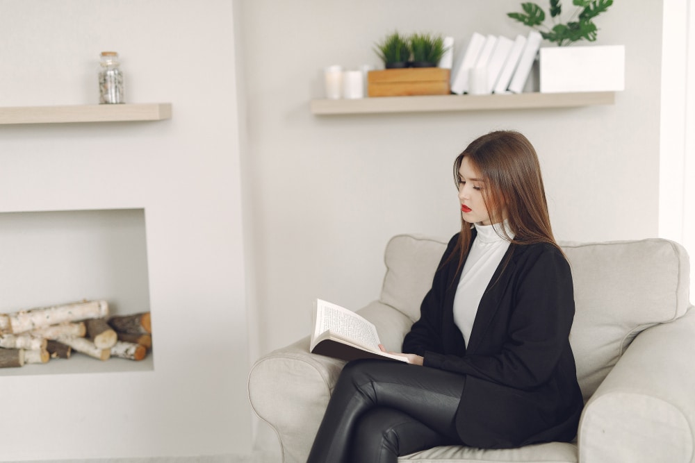 calm private psychiatry office with natural light, neutral chair, and notebook