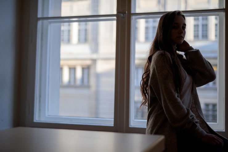 Person experiencing anxiety and intrusive thoughts related to harm OCD in Austin TX